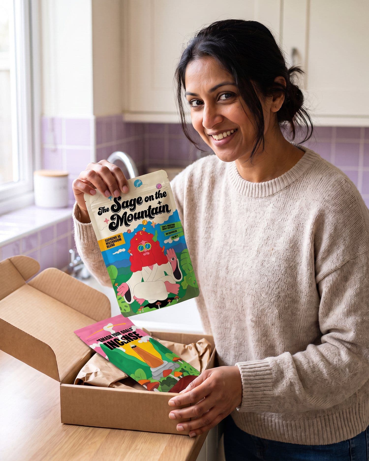A customer at her kitchen counter lifting the Supreme 10 Mushroom Blend pouch out of its delivery box, the incense pouch still inside